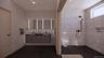Full bath with double vanity and a walk in shower