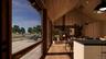 Welcome area featuring wooden walls, high vaulted ceiling, and wooden ceiling