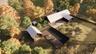 View from above of property featuring a forest