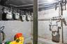 Unfinished basement featuring gas meter
