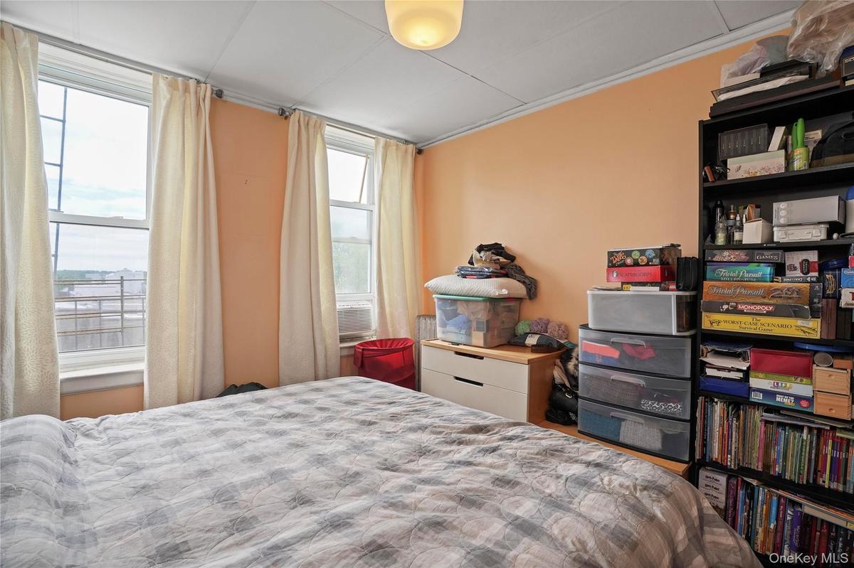 Bedroom featuring multiple windows