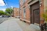 View of exterior entry featuring brick siding