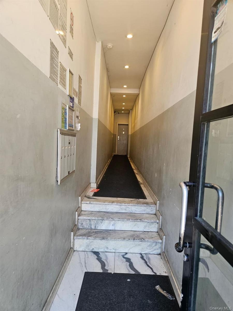 Stairs featuring mail area, marble finish floors, and recessed lighting