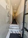 Stairs featuring mail area, marble finish floors, and recessed lighting