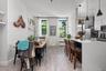 Dining space featuring light wood-style flooring and radiator heating unit