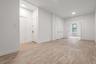 Unfurnished room with light wood-type flooring and radiator heating unit