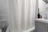 Full bathroom featuring shower / bath combo with shower curtain and vanity
