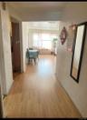 Hallway with wood finished floors