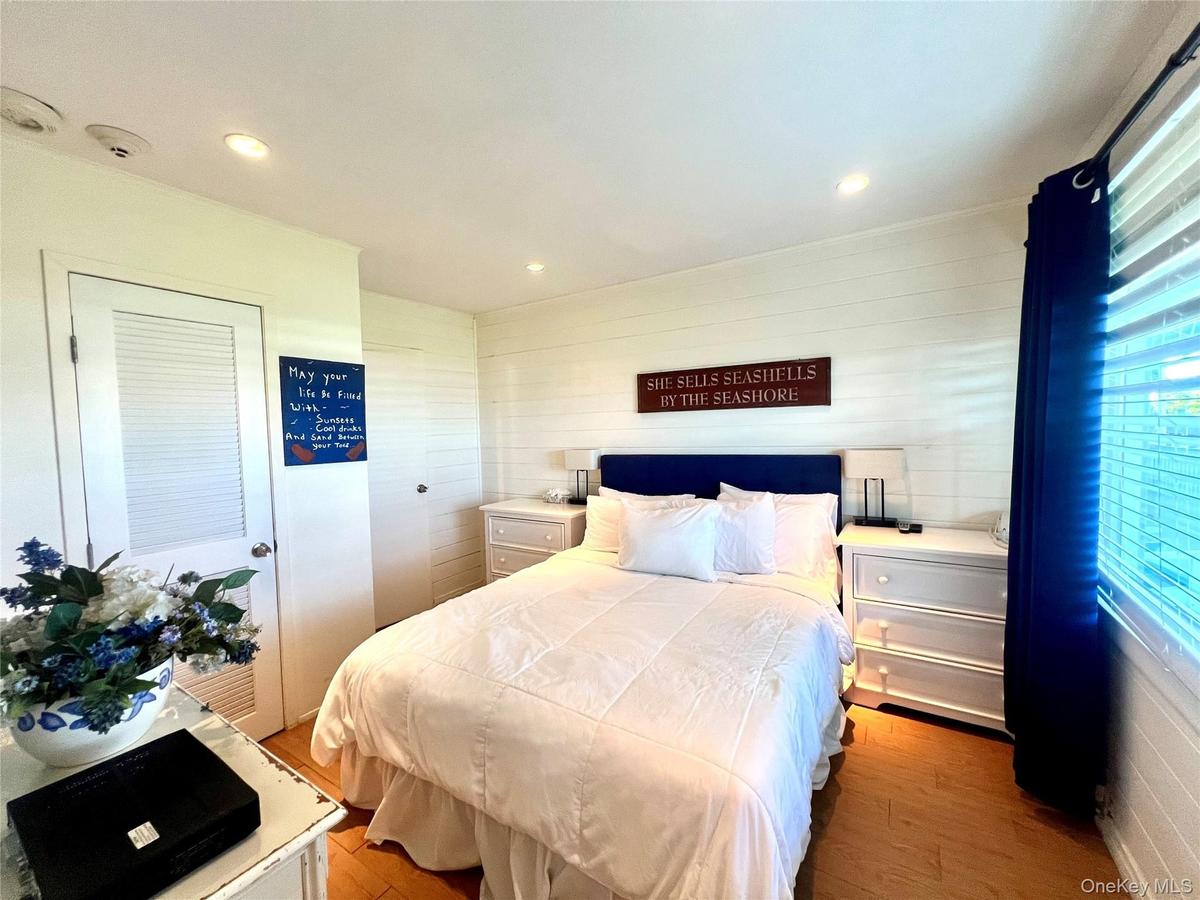 Bedroom featuring light wood-type flooring, a closet, and recessed lighting