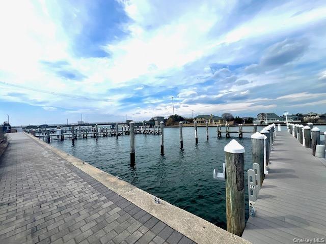 Opposite unit. Dock featuring a water view