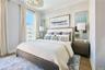 Bedroom featuring crown molding and wood finished floors