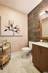 Bathroom featuring vanity and tile walls