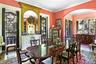 Dining area featuring arched walkways, wood finished floors, and ornamental molding