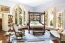 Bedroom with radiator, wood-type flooring, and crown molding