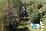 Drone / aerial view of home and a pool
