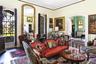 Living area with wood finished floors and ornamental molding