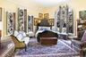 Bedroom with crown molding, wood-type flooring, and baseboards