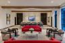 Community lobby featuring beamed ceiling and recessed lighting