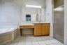 Spacious primary bath with two vanity areas & separate tub & shower