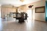 Dining area with a chandelier, light tile patterned flooring, and a ceiling fan