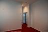 Empty room featuring dark colored carpet and recessed lighting