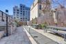 View of home's community featuring a fenced backyard, outdoor dining area, a patio area, and area for grilling