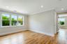 Spare room with crown molding, baseboards, light wood finished floors, and recessed lighting