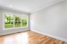 Unfurnished room featuring baseboards, crown molding, and light wood finished floors