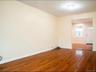 Spare room with wood finished floors and baseboards
