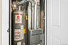 Utilities featuring heating unit and water heater