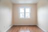 Unfurnished room featuring baseboards, visible vents, and light wood-style flooring