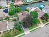 Aerial view of residential area featuring a large body of water
