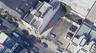 Aerial view of property and surrounding area featuring property parcel outlined