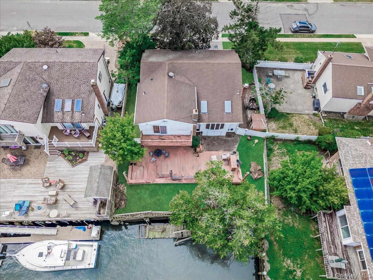 Aerial view of residential area featuring a large body of water