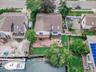 Aerial view of residential area featuring a large body of water