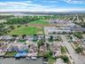 Aerial view of residential area featuring a large body of water