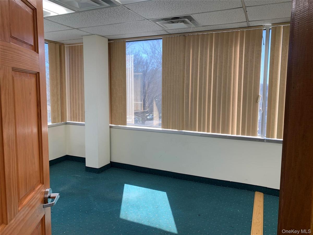 Unfurnished room with a paneled ceiling