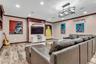 Living room with crown molding, baseboards, light wood-type flooring, recessed lighting, and baseboard heating