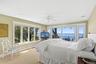 Carpeted bedroom with access to exterior, ceiling fan, and recessed lighting