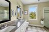 Bathroom with a shower stall and double vanity
