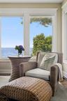 Living area featuring a water view and wood finished floors