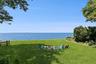 View of grassy yard featuring a water view