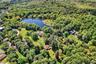 Aerial view of a large body of water and a heavily wooded area