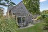 Rear view of property featuring a patio