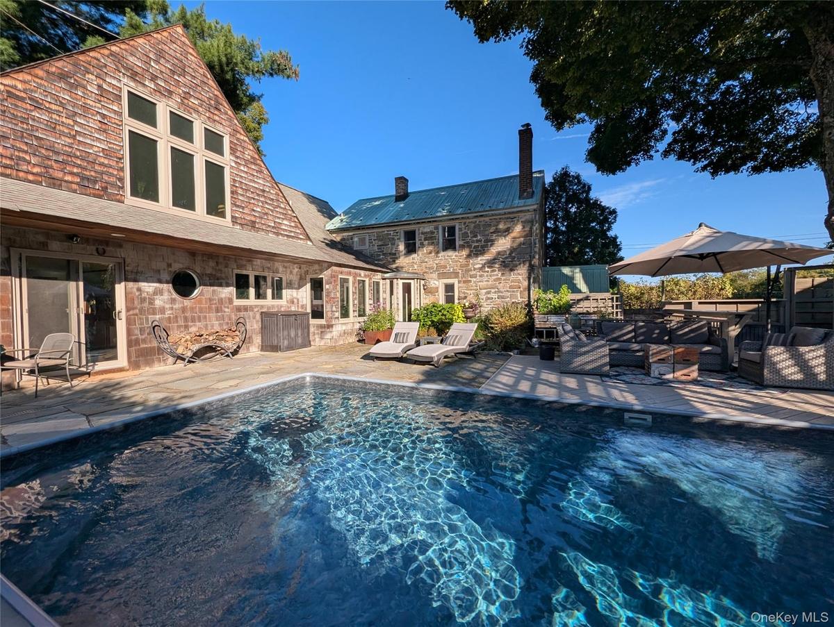 Outdoor pool with a patio area