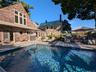 Outdoor pool with a patio area