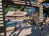 Deck featuring an outdoor pool, and a patio area