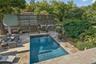 View of pool with an outdoor living space and a wooden deck