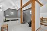 Full bath featuring vaulted ceiling, a garden tub, a stall shower, and tile patterned flooring