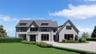 View of front of property featuring board and batten siding and a front yard